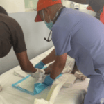 girl in haiti with a leg injury