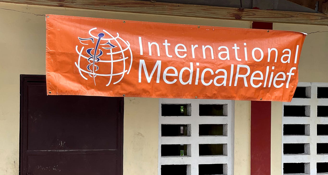 IMR banner outside clinic in Haiti