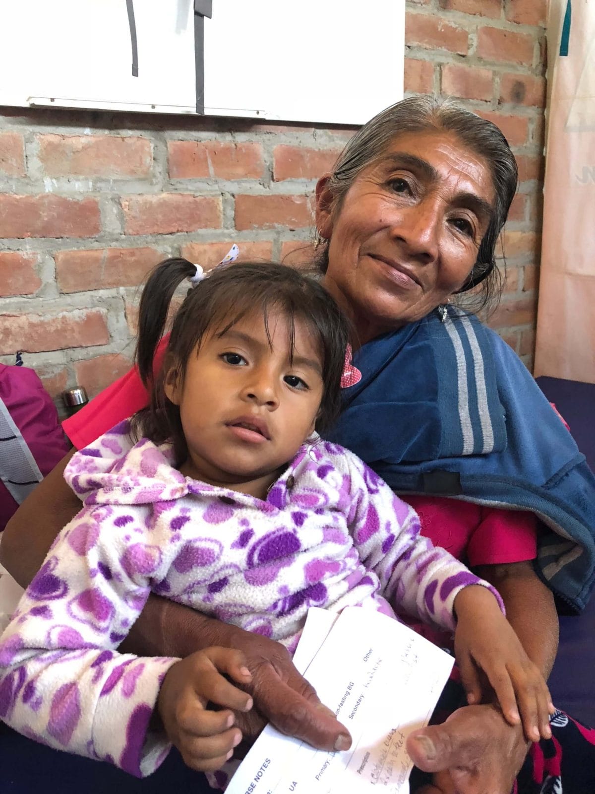 Woman, girl patients at clinic in Ecuador