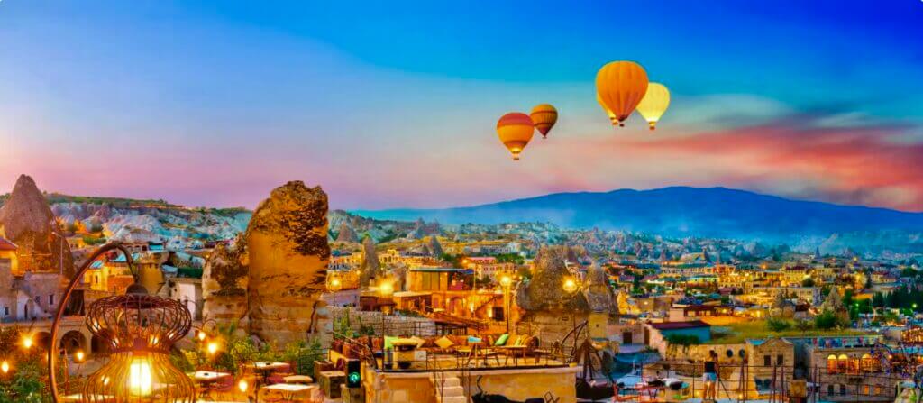 Cappadocia village with hot air balloons