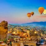 Cappadocia village with hot air balloons