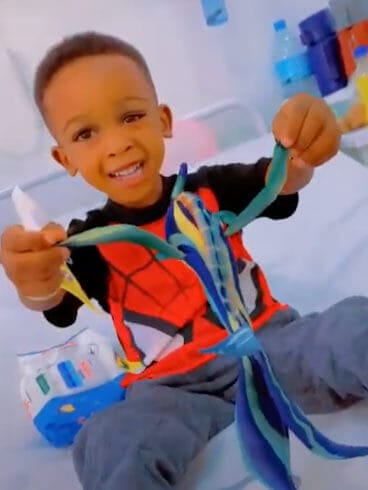 young boy with toy