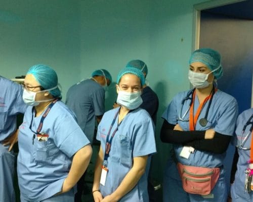 Photo of an IMR surgical team being briefed before surgery